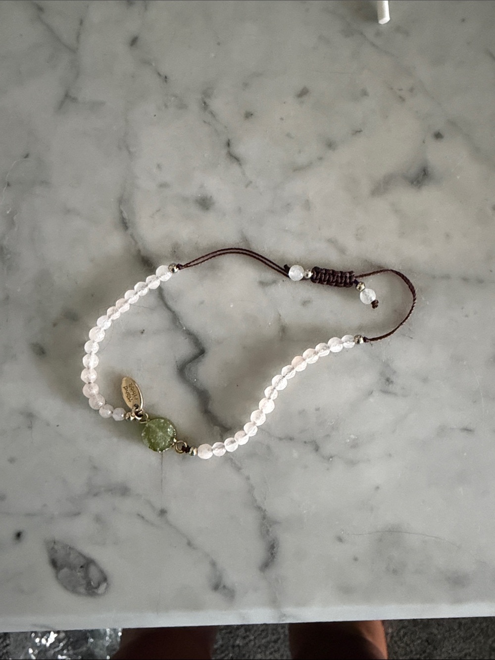 Handcrafted White Beaded Bracelet with Green Stone Accent